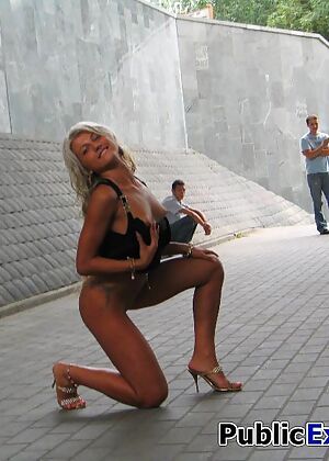 Swarthy blonde undresses
